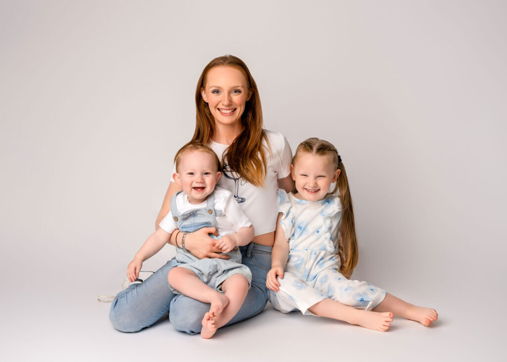 Family wearing layered outfits with textured fabrics in Belfast photo sessio